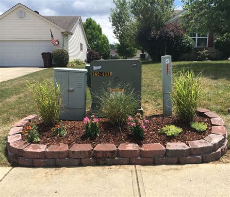 green electrical box in backyard put up privacy fence|hiding utility boxes around house.